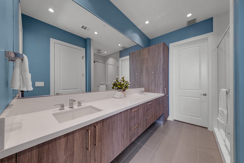 Condo bathroom with long vanity