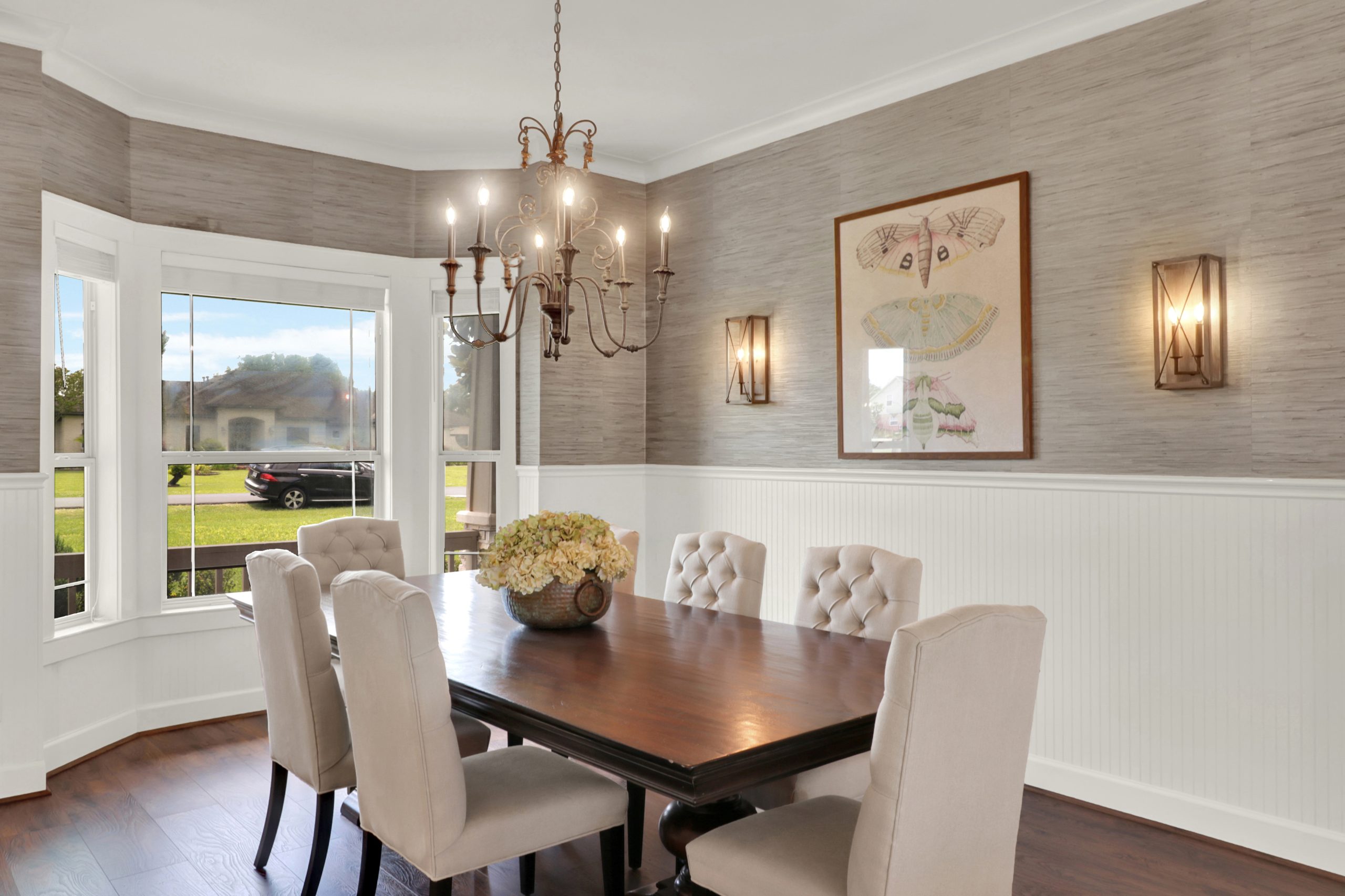 Dining room with chandelier and bay windows
