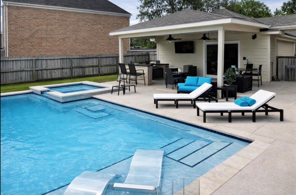 Backyard pool and spa with covered outdoor living area